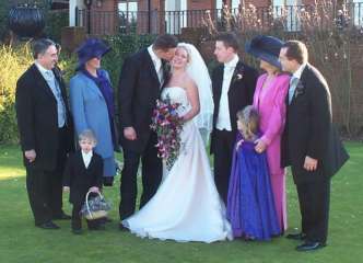 35x25 parents and RAJ kiss.jpg (13129 bytes)